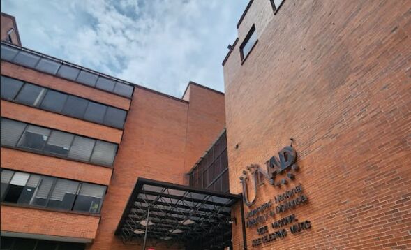 The UNAD building, with the university name on the brick wall by the entrance.