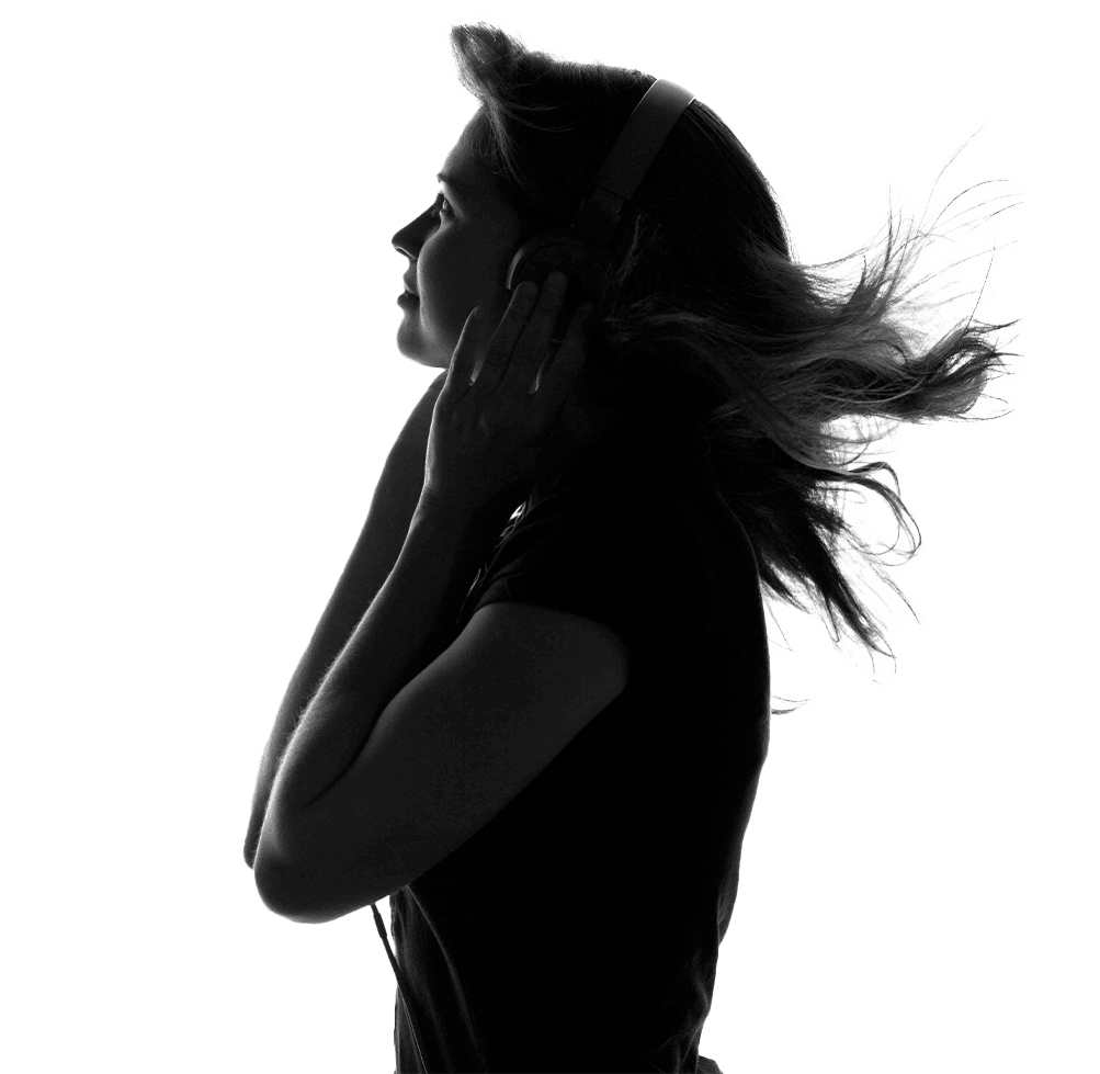 Woman in silhouette listening