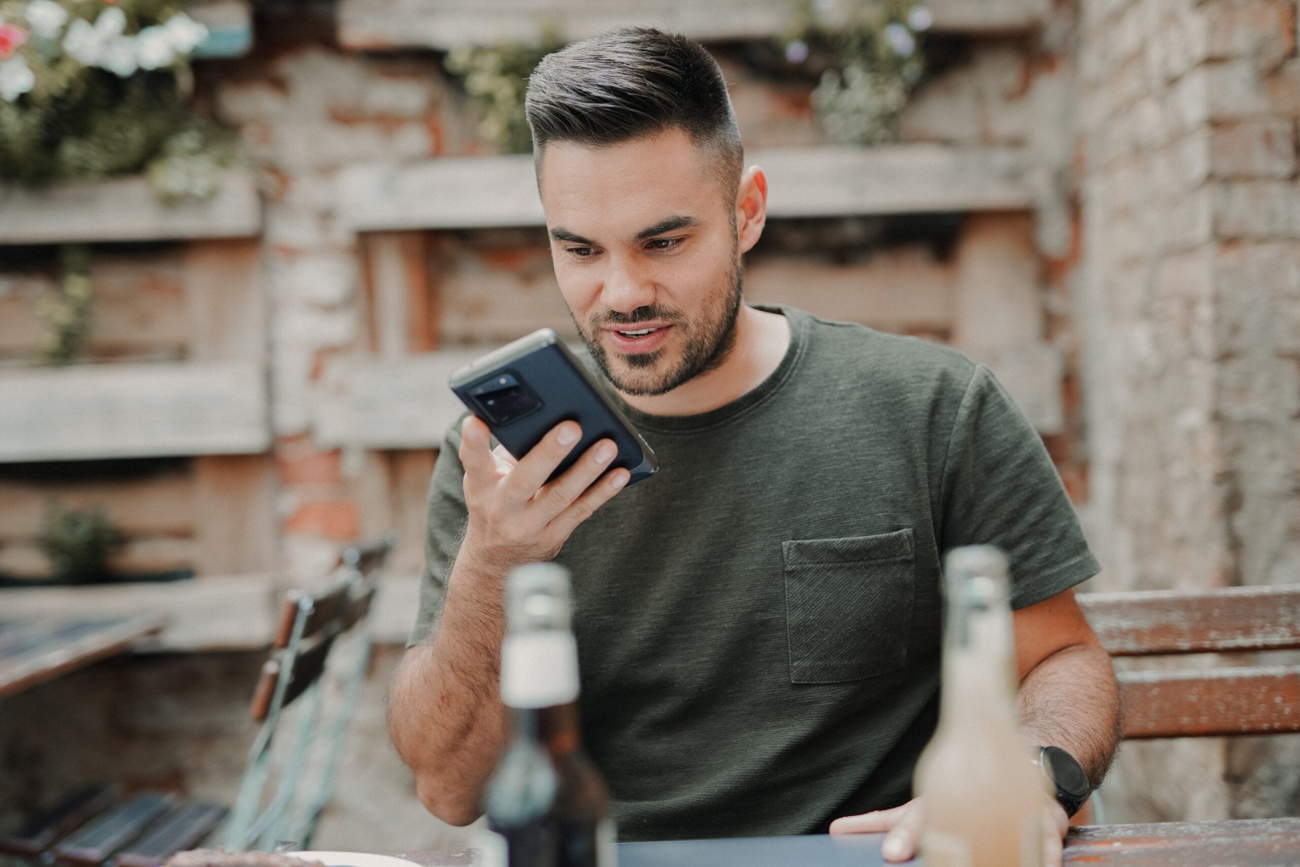 A man speaking to his smartphone