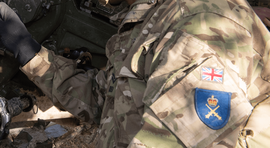 A soldier wearing the Royal Artillery badge