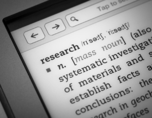 Screen of an electronic device showing a definition of research.