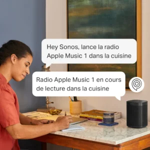 A woman interacts with a connected device to ask it to play music.