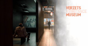 Two people in a museum with "Verzets Resistance Museum" written on the right.